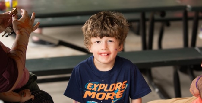 a child sitting at a table