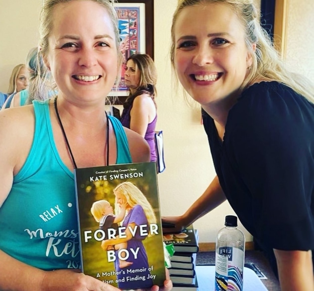 two women smiling at the camera