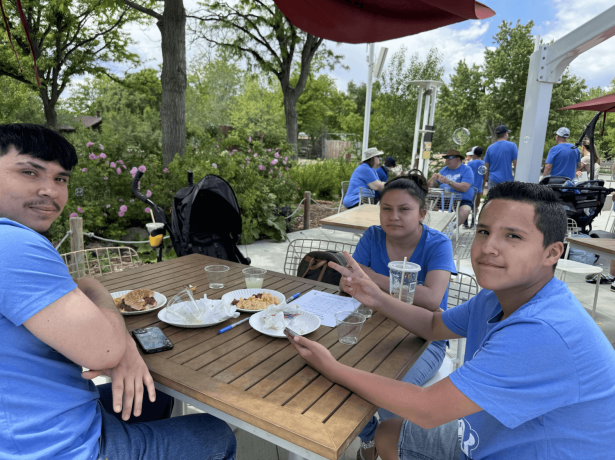 a group of people sitting at a table