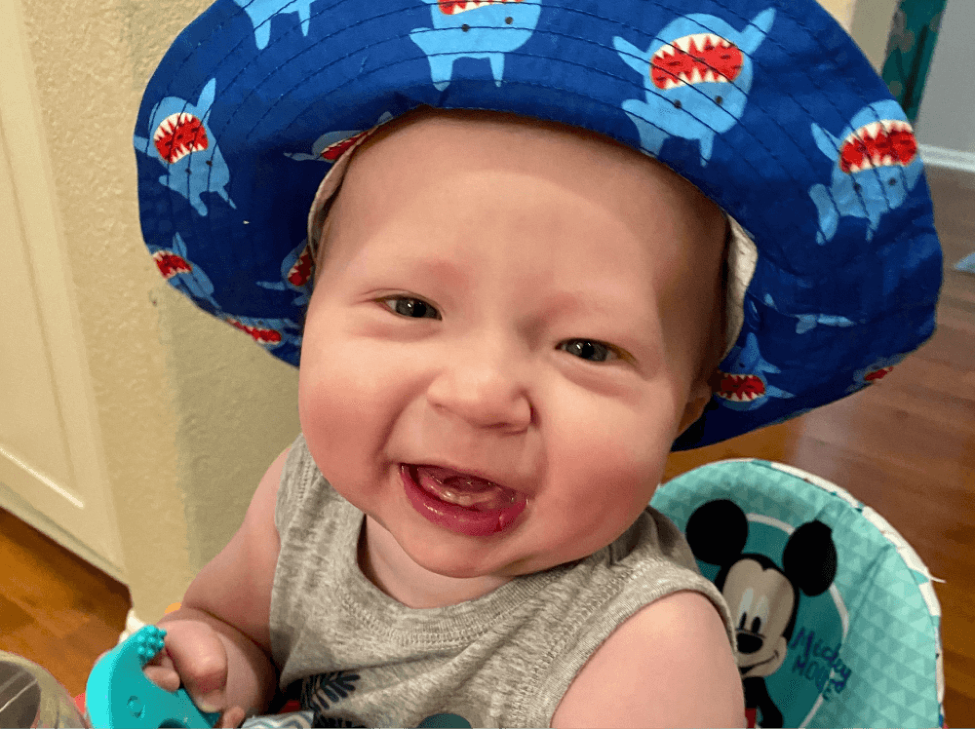 a baby wearing a blue hat