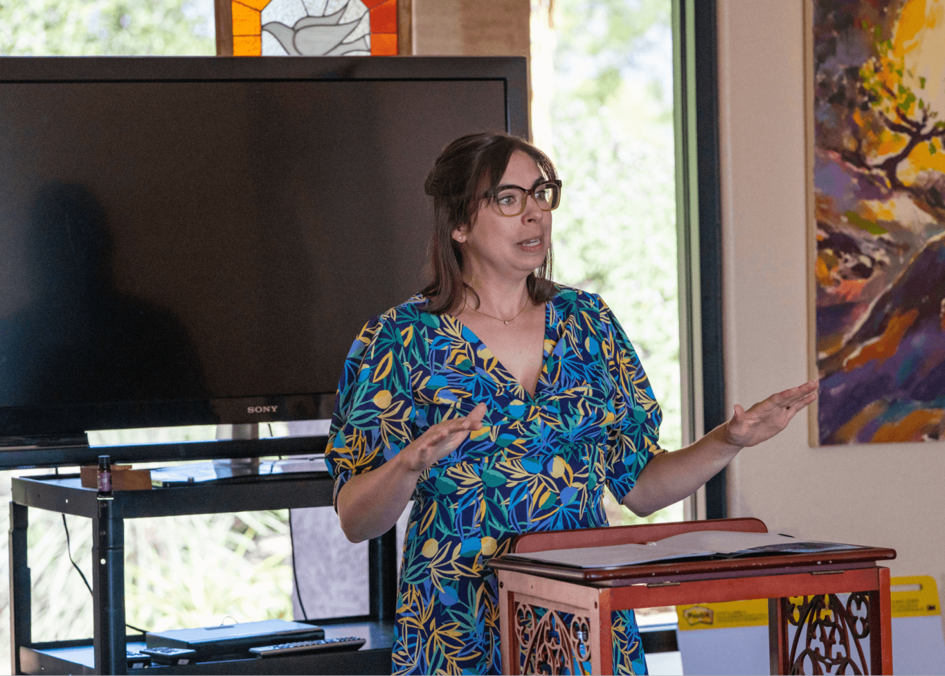 a person standing in front of a tv